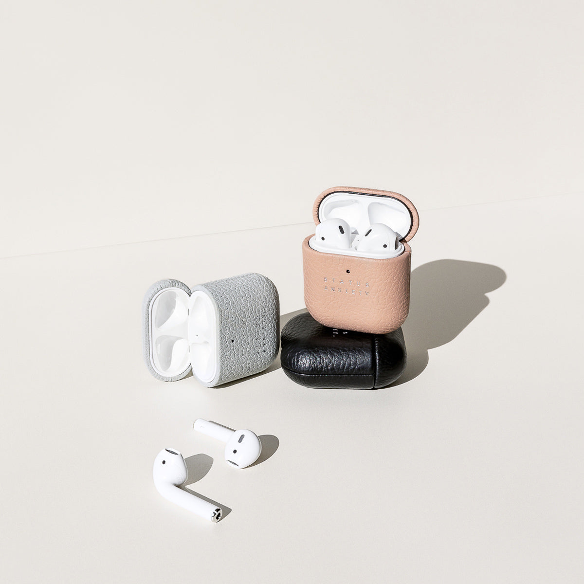Status Anxiety Miracle Worker Leather Airpods Case Light Grey